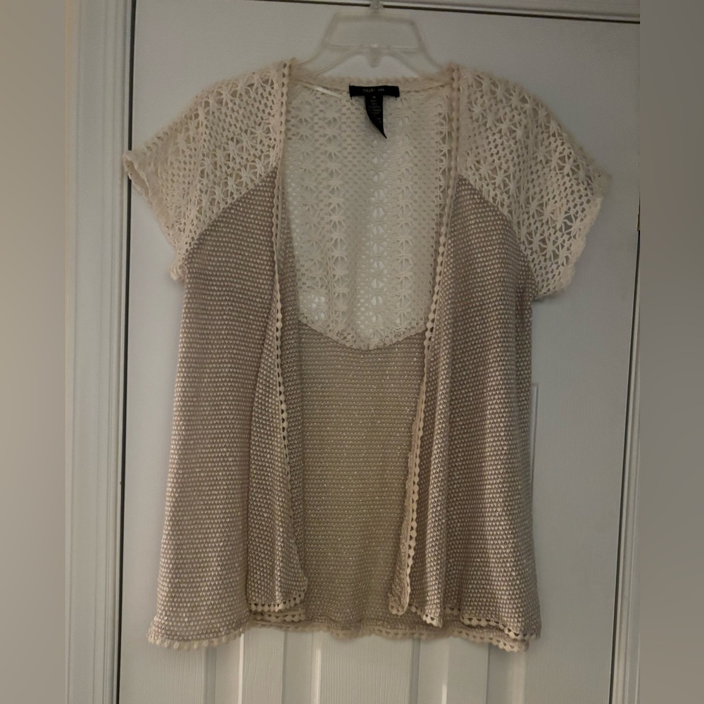 Lightweight cardigan sweater with a crocheted top and a lightweight bottom.